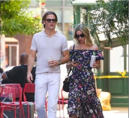 Chris Pine with his girlfriend Annabelle Wallis walking outdoors
